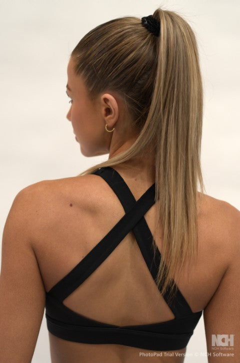 True Committ Sports Bra - Model is wear a size small