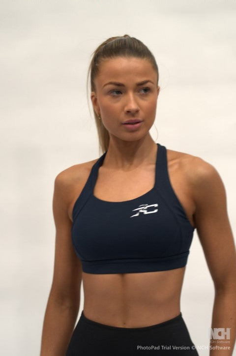 True Committ Sports Bra - Model is wear a size small